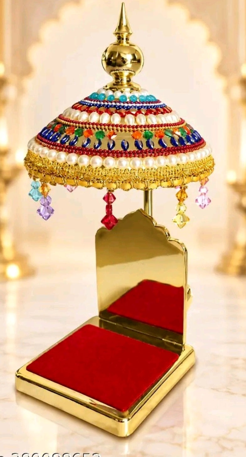 Close-up of the jeweled Chhatra canopy and red seat