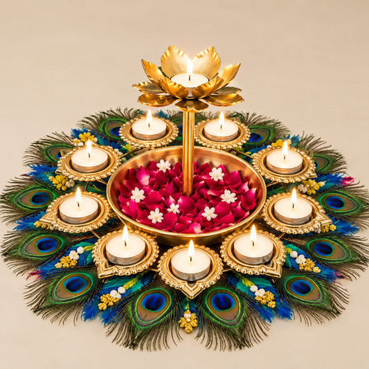 Actual product photo of an ornate gold-tone Diwali diya centerpiece with a raised lotus candle holder, surrounding tea-light holders, central flower tray, and peacock-feather base on a clean beige background
