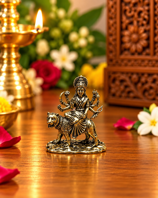 Antique-finish Goddess Durga idol riding a lion, front view