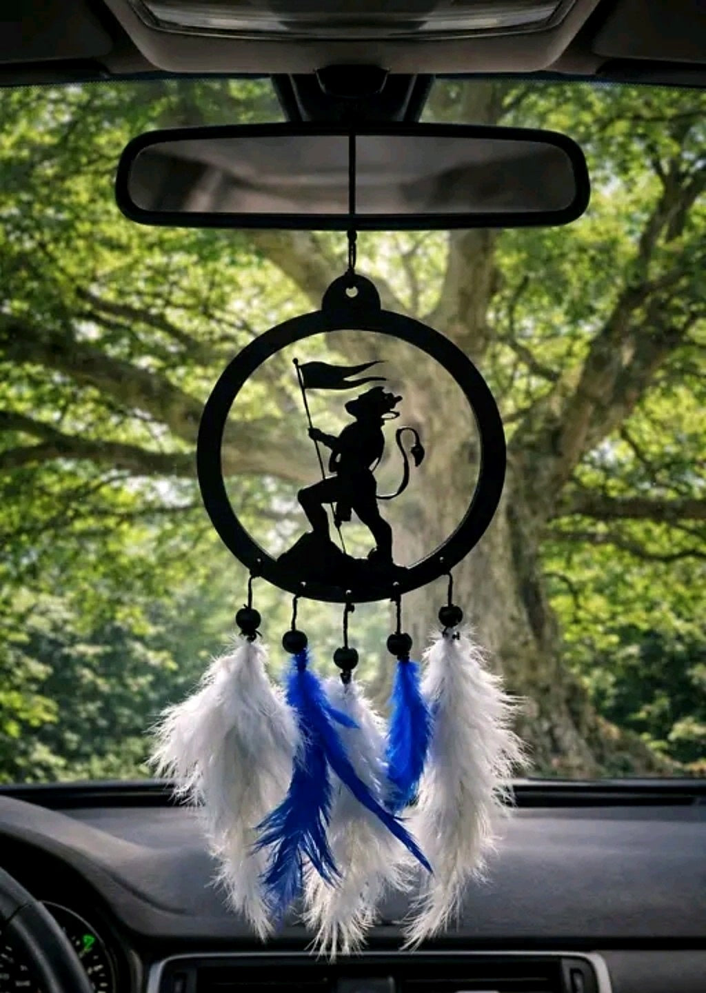 Main product image of black circular Hanuman flag silhouette hanging with blue and white feathers