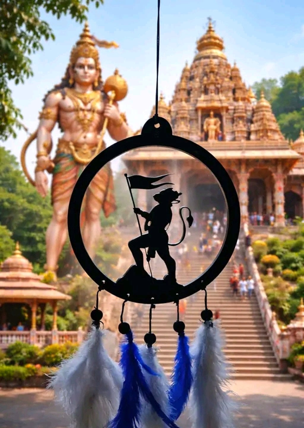 Hanuman flag silhouette and blue-white feather car hanging against a bright sky