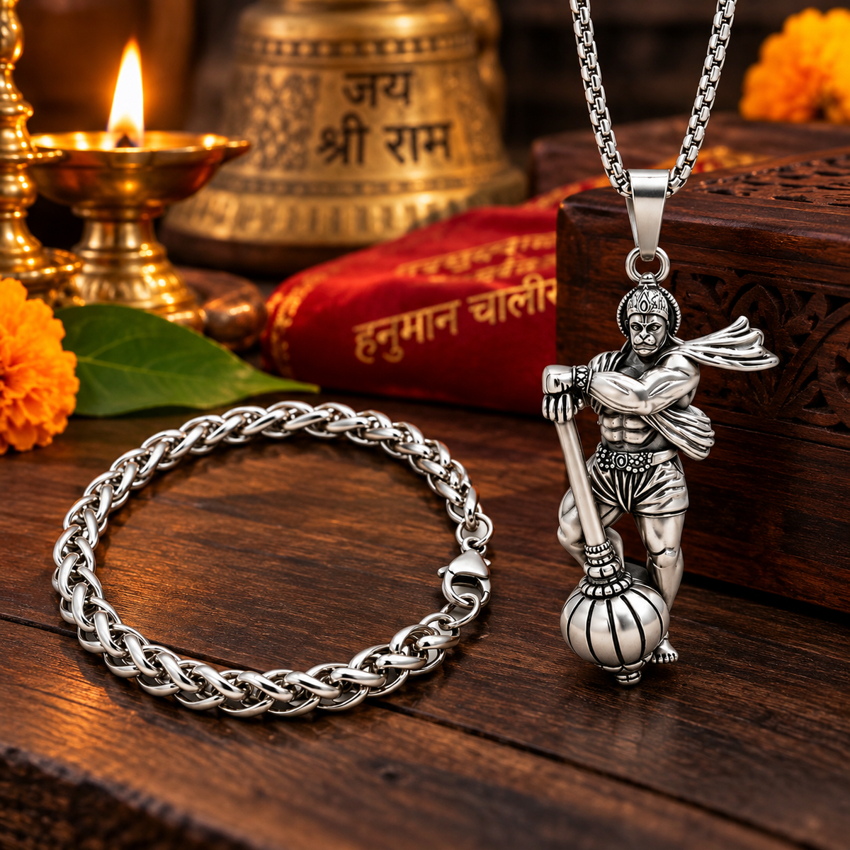Hanuman pendant necklace and matching chain bracelet arranged in a warm devotional lifestyle setting