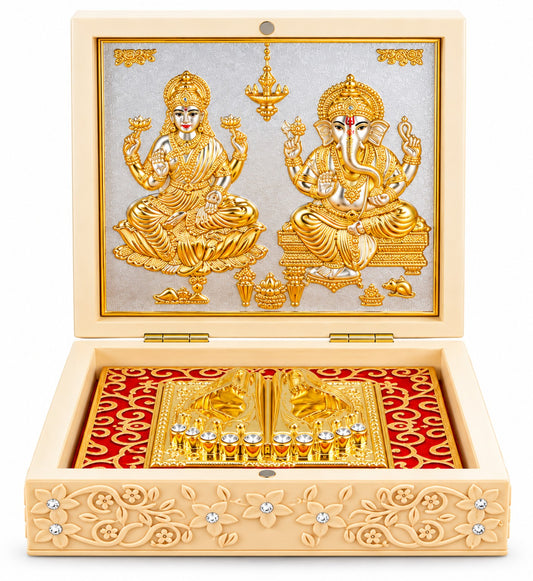 Actual product photo of an open cream decorative pooja box featuring gold-tone Goddess Lakshmi and Lord Ganesha reliefs, ornate inner tray, and floral detailing