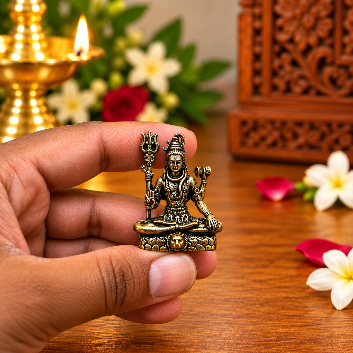 Close-up of the antique brass Lord Shiva idol with trident and damaru
