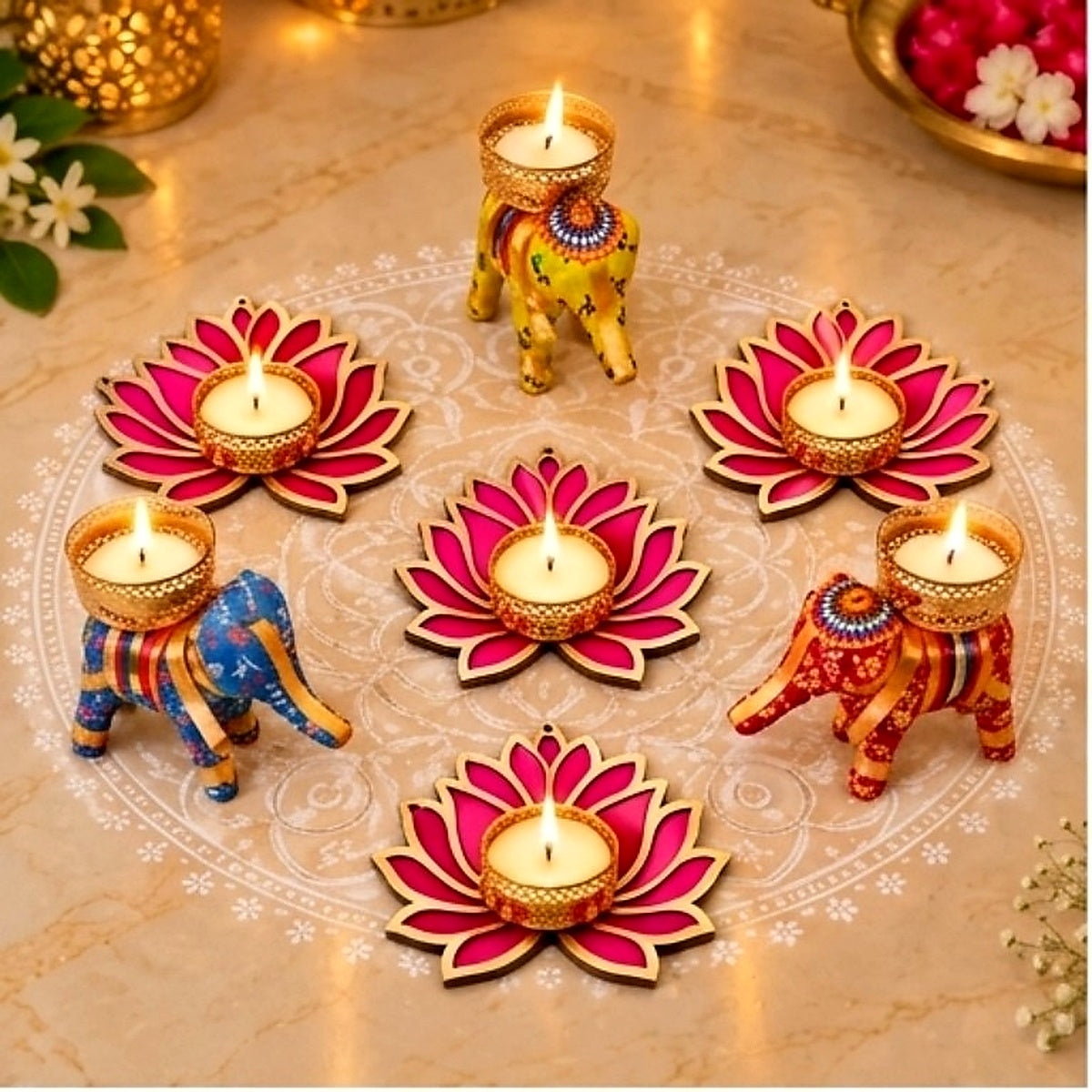 Set of seven decorative diya candles with lotus and elephant designs — main product view