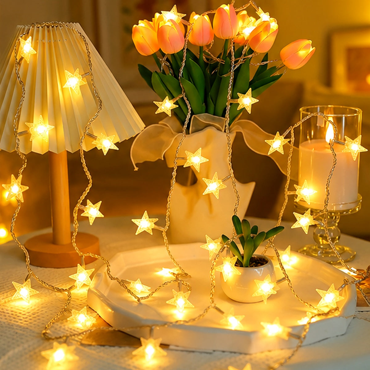 Warm white star LED string lights arranged around home decor